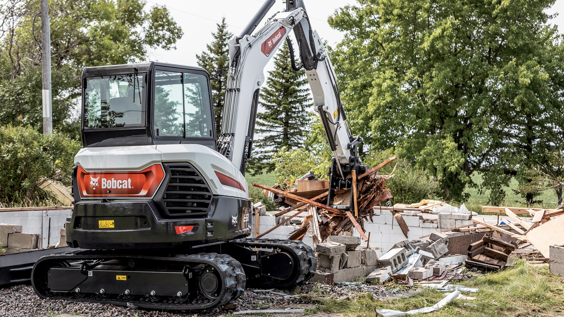 The Bobcat E60 Mini Excavator showcases its demolition strength, efficiently handling debris and rubble in challenging work environments.