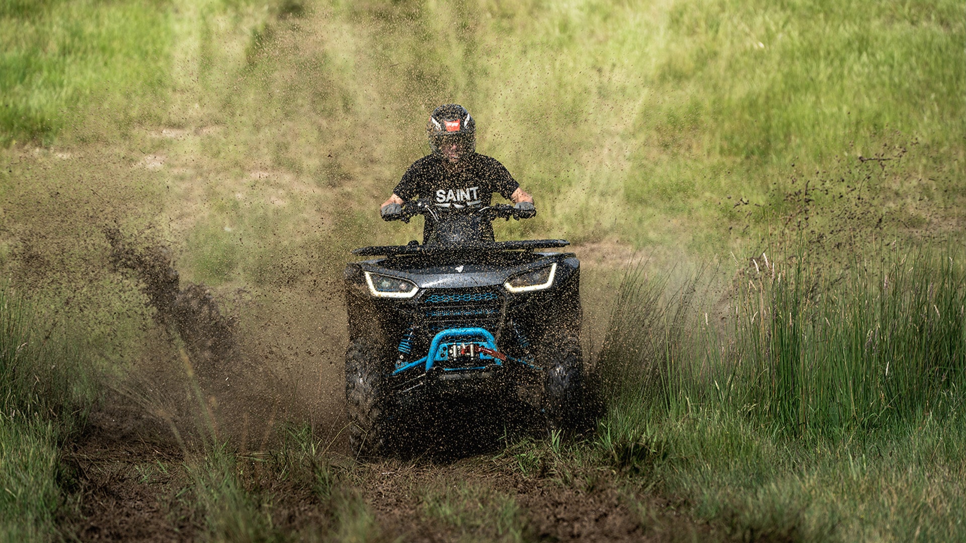A rider powers through a muddy trail on one of the Segway Farm Quad Bikes, spraying dirt as the all-terrain vehicle demonstrates its off-road strength and control in rugged farm conditions.
