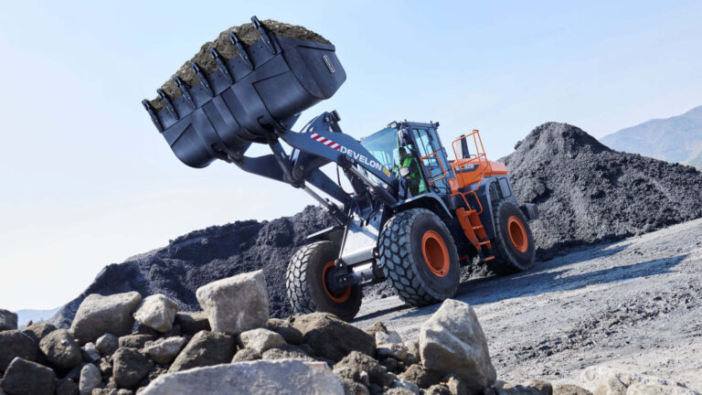 Wheel loader loading rock at a quarry, symbolising Mawsons’ rehabilitation work and Ararat bridge upgrades strengthening regional Victoria’s earthmoving capacity.
