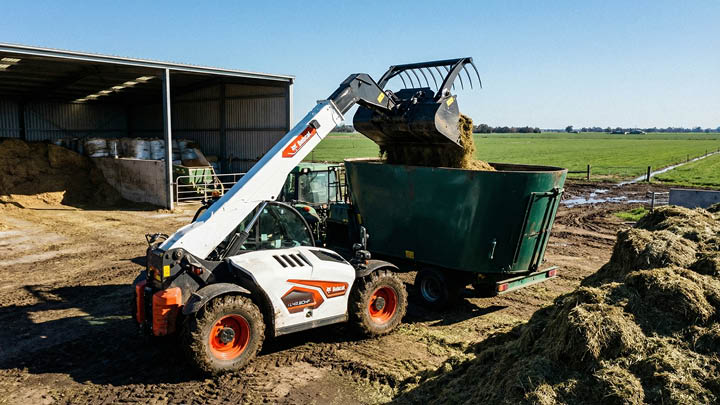 Bobcat TL43.80HF agricultural telehandler loading feed mixer wagon on large Central Victorian dairy farm