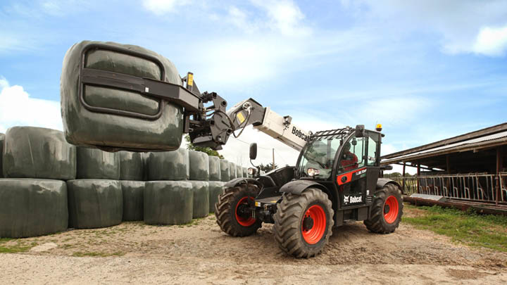 Telehandler hire for agriculture - handling silage bales on farm near Bendigo